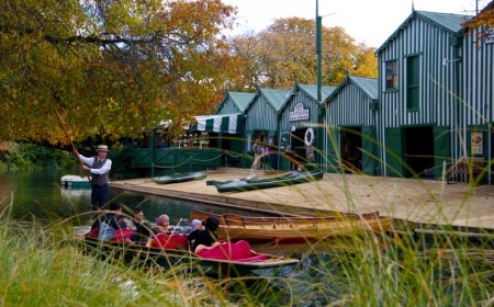 Asian visitors punting on Avon